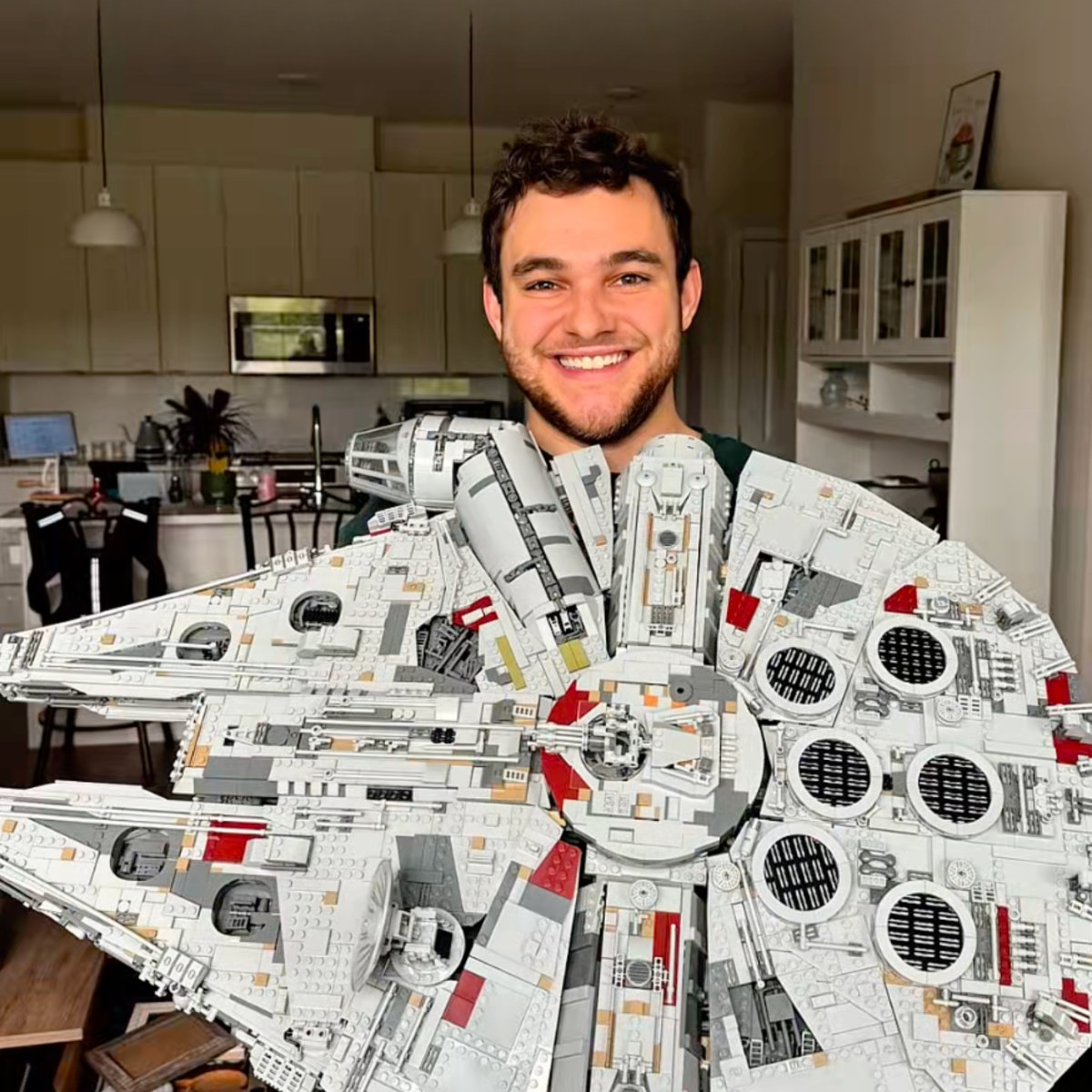 Builder with his finished Millennium Falcon